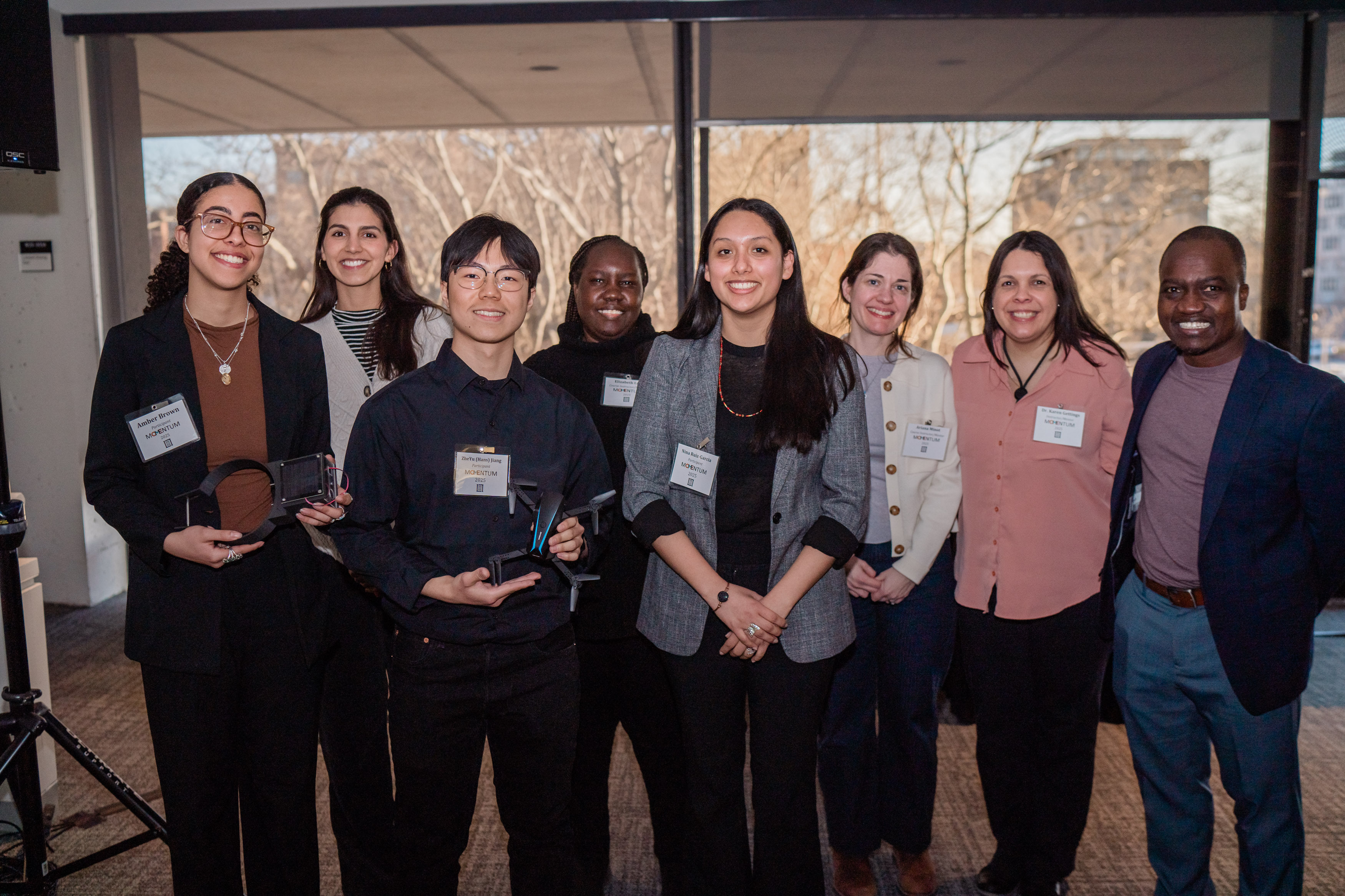 One of the winning Momentum 2025 teams pose with MIT Lincoln Laboratory Staff members.